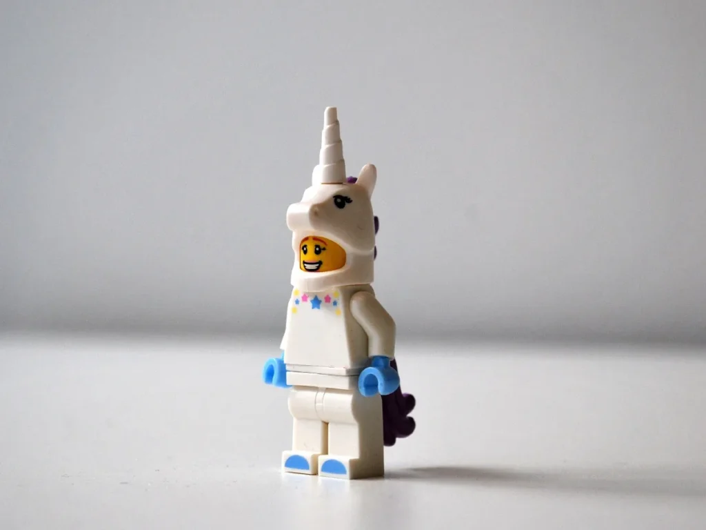 A Lego person in a unicorn costume